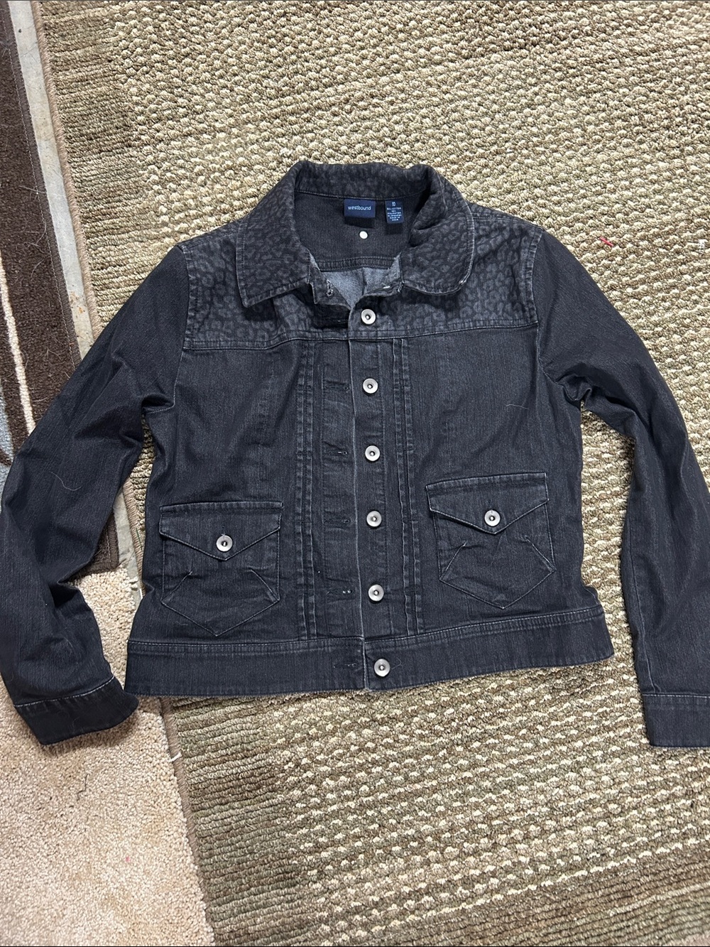 Black denim jacket with animal print on shoulder and collar.